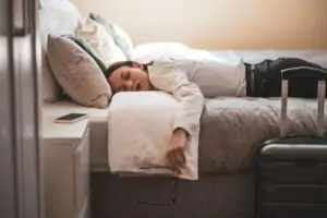 Guest Sleeping in Hotel Room